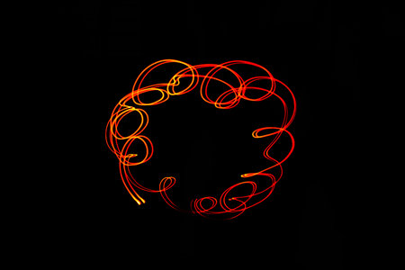 Creative conceptual fine art photography motion blur sparkle light trail on dark background copy...