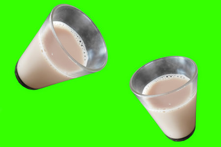 closeup of drinking glasses with tea green backgroundの写真素材