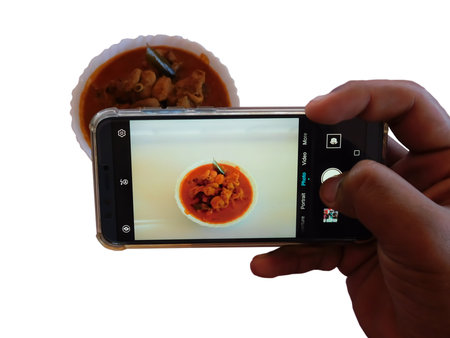 Food or technology concept : Woman hands taking food photo by mobile phone white background