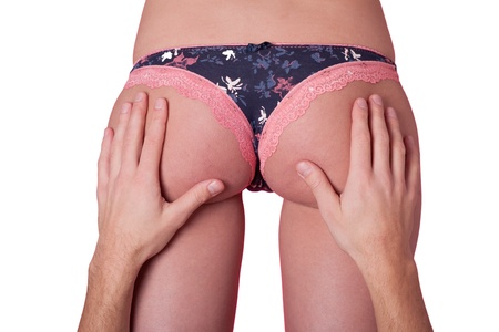 Hands of a man on woman s buttocksの写真素材