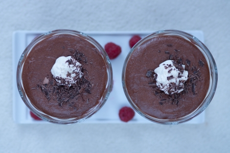 Chocolate cream dessert with whipped cream in glassの写真素材