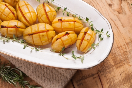 Potatoes with bacon slices decorated with thymeの写真素材
