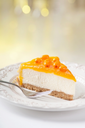 Tasty sea-buckthorn cake slice on beautiful plateの写真素材