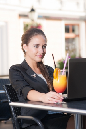 Beautiful businesswoman working in cafe  の写真素材