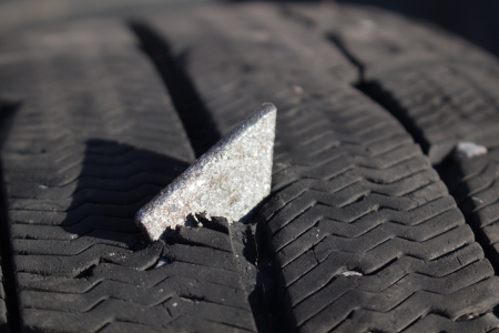 Metal plate in car tireの写真素材