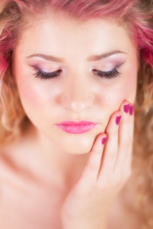 Attractive woman with colorful makeup and hairstyle, focus on eyelashesの写真素材