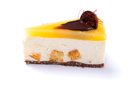 Delicious mango cake isolated on white backgroundの写真素材