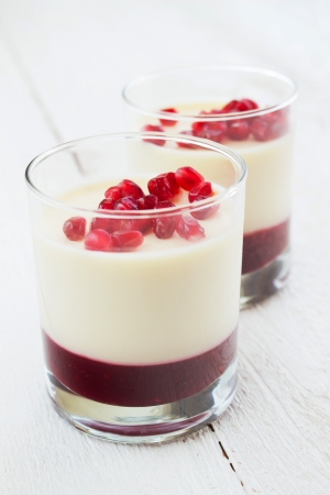 Panna cotta dessert with pomegranate seedsの写真素材