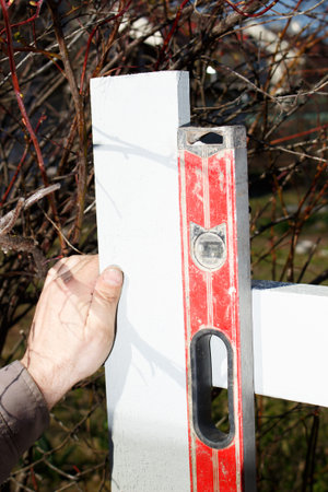 Man plumbing garden plank