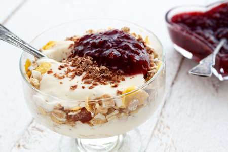 Muesli with yoghurt and raspberry jamの写真素材