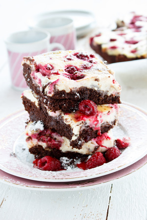 Cheese and chocolate cake with raspberriesの写真素材