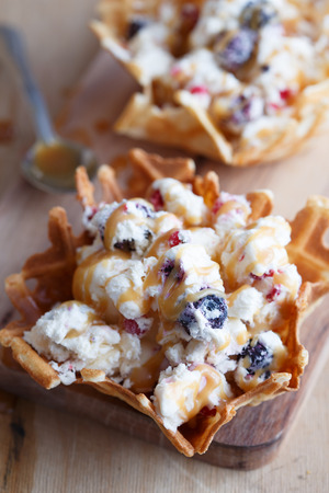 Berry ice creame in waffle with sweet sauceの写真素材