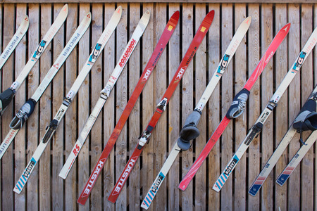 26-TH OF APRIL 2014 - MÃEDAKU,ESTONIA: Vintage skis hanging on wall in sports centerのeditorial素材