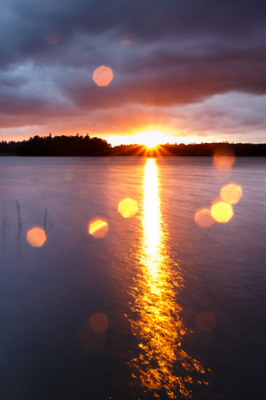 Sunset image with lens flareの写真素材