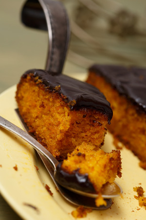 Carrot cake with dark chocolate decorationの写真素材