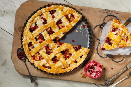 American pie with apple,foxberry and pomegranate seeds ingredientの写真素材