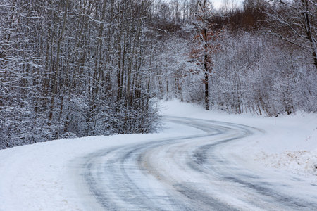 Curvy and slippery winter raod studed tires neededの写真素材