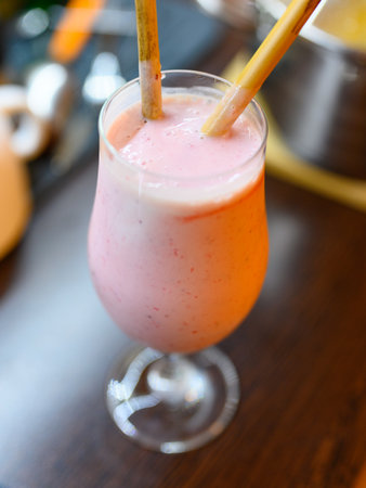 Fresh strawberry smoothie ready to eat, bamboo strawsの写真素材