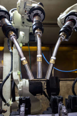 Close-up robots are welding in a car factoryの写真素材