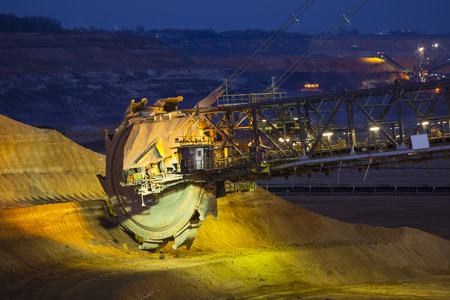 A giant Bucket Wheel Excavator in a lignite pit mine at nightのeditorial素材