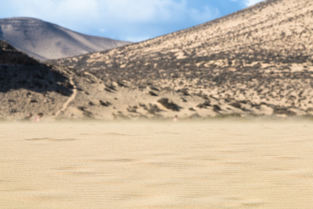 Flying sand in the famous lagoon at Playas de Sotavento, Fuerteventura during low tideの写真素材
