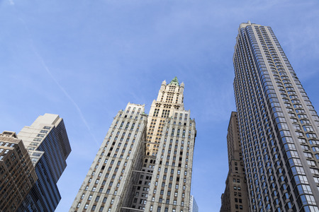 The old Woolworth Building between other skyscrapers in New York with blue skyのeditorial素材