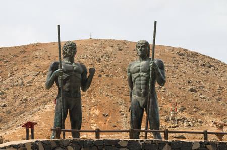 FUERTEVENTURA - OCTOBER 25: The statues of the Guanche kings Ayos and Guize in Fuerteventura, Spain on October 25, 2013のeditorial素材