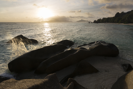 Sunset at Anse Source D'Argent in La Digue, Seychelles with a granite rock in the foregroundの写真素材