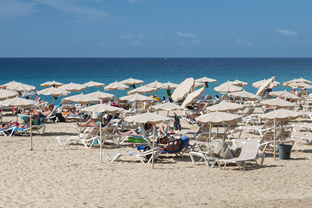 FUERTEVENTURA - OCTOBER 20: The endless Jandia Beach in Fuerteventura, Spain with some tourists on October 20, 2013のeditorial素材