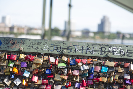 COLOGNE - MAY 14: Love padlocks attached to every possible spot on the Hohenzollern Bridge in Cologne, Germany on May 14, 2015のeditorial素材