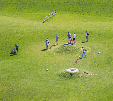 INDEN - MAY 5: Aerial view of people playing soccer golf on a green lawn on May 5, 2016.のeditorial素材