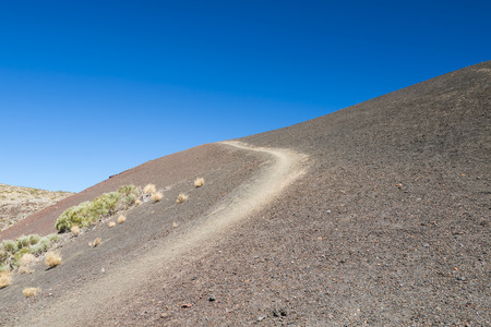 Footpath through lava pebble in the caldera of Tenerife, Spain.の写真素材