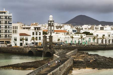 LANZAROTE - JANUARY 5: View from the Castillo de St. Gabriel to Arrecife in Lanzarote, Spain with dark clouds on January 5, 2016.のeditorial素材