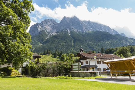 GRAINAU - JULY 3: View over a Grainau village, Germany to the Waxenstein Mountain in summer on July 3, 2016.のeditorial素材