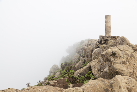 On top of the Pico De La Zarza, the highest mountain in Fuerteventura. It is very often wrapped in clouds even in the morning. To the left it goes steeply down to El Cofete.の写真素材