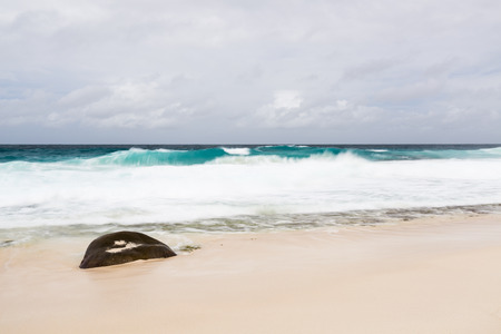 Long exposure shot at Anse Bazarca in the south of Mahe, Seychelles on a stormy day.の写真素材