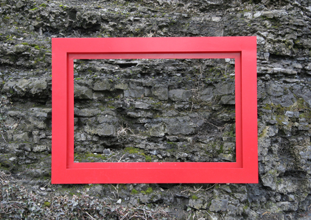 This empty red metal frame may be filled with whatever.の写真素材
