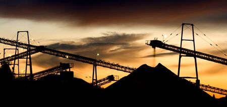 Part of a gravel plant with dramatic sky in panorama format.の写真素材
