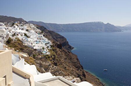 View of the village Oia in Santorini, Greece with Imerovigli in the background.の写真素材
