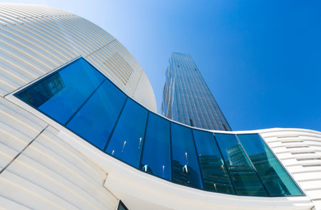 Low angle view of curved modern architecture in Viennas Donau City with the Donau City Tower in the...