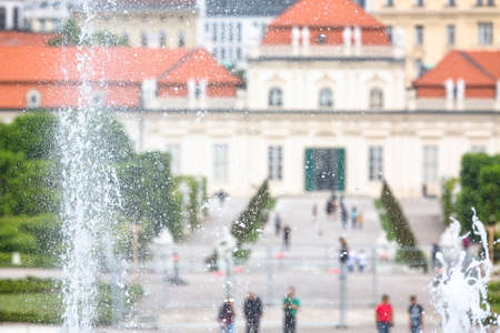 View to the Lower Belvedere in the Belvedere Palace park of Vienna, Austria with focus on a fountain in the garden.のeditorial素材
