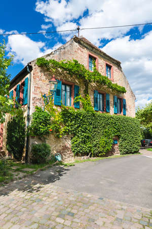 Street with idyllic old house in Neustadt an der Weinstrasse, Germany on a clear summer day.のeditorial素材
