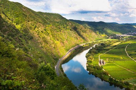 View of a riverbend of the Moselle River near the Eifel village of Bremm in Germany in summer. Seen...