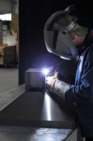 welder works in a metal construction company