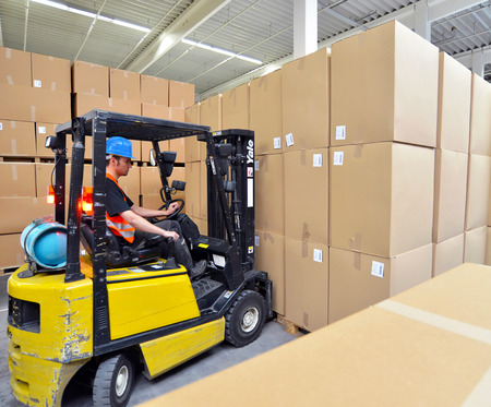 Forklift driver in a warehouse for industrial goodsのeditorial素材