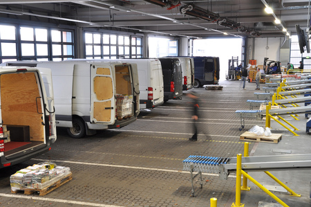 transporter in the handling of a company for the dispatch of goods - loading with daily newspapers in a printing companyの写真素材