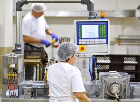 food industry - biscuit production in a factory on a conveyor beltの写真素材