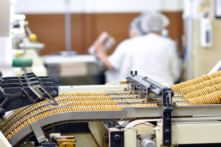 food industry - biscuit production in a factory on a conveyor belt の写真素材