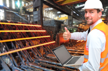 engineer works in a steel mill - metal production in the industryの写真素材