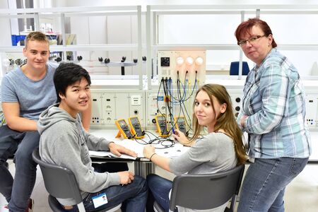 technical vocational training in industry: young apprentices and trainers in the classroomの写真素材